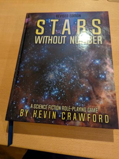 Eine Hardcover Ausgabe des Rollenspieles Stars without number von Kevin Crawford