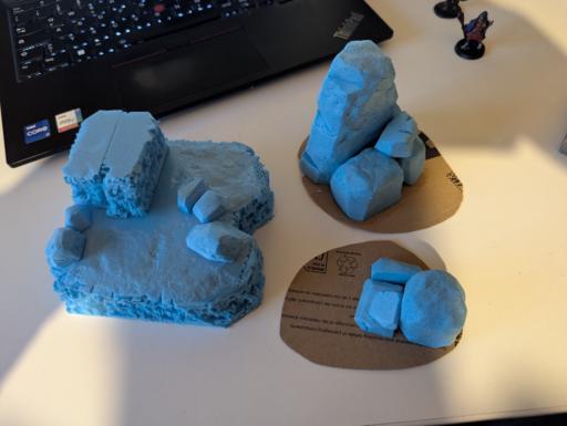 Three pieces of unfinished rock terrain made from blue 5cm thick XPS